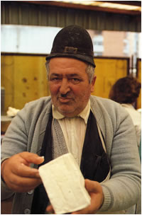 Looking for George - selling cheese in a Romanian markey